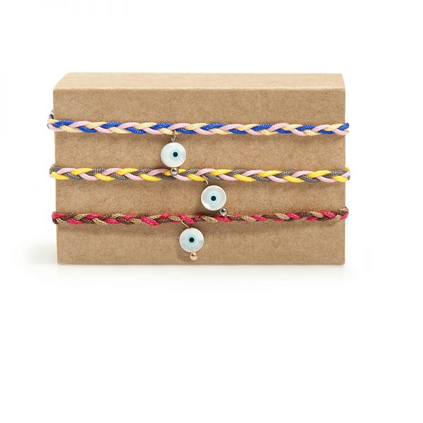 Blink - A handmade little eye-bracelet made of ivory and a colorful hand-knit cord forming a braid. An everyday, fun wristband, essential in order to protect you from the "evil" eye! Closes with a macramé wrist clasp.

Material: Oxidized silver 925 and ivory