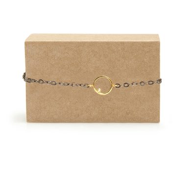 Touch - The geometric simplicity of this bracelet makes it so special that you are going to love it! The circle is made of 14k gold and gold zircons held together on an oxidized silver chain. Closes with a clasp.

Material: 14k gold with gold zircon and oxidized silver chain