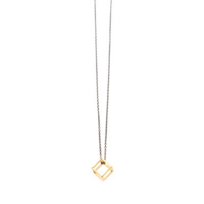 Cube - Short necklace with a three-dimensional cube made of 14k gold. A jewelry perfectly geometric, elaborate and unpretentious. You can combine it with longer necklaces to make your outfit even more stylish and create the perfect layering opportunity. We recommend you wearing it with the Wave or the Pinpoint necklaces from our collection.

Length: 40cm

Material: 14k gold with a silver oxidized chain